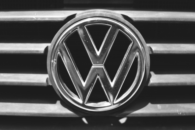 Silver Volkswagen logo on a vintage van